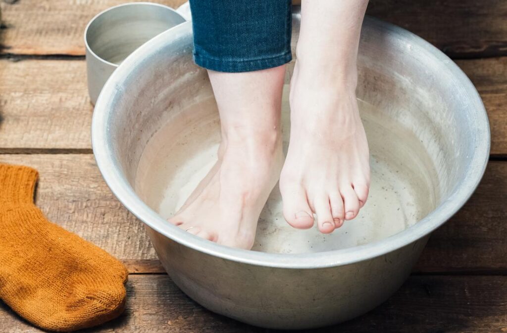 Soak the feet and hands in warm water.